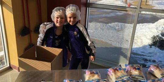 full picture of nicole and daughter at feed my starving children working